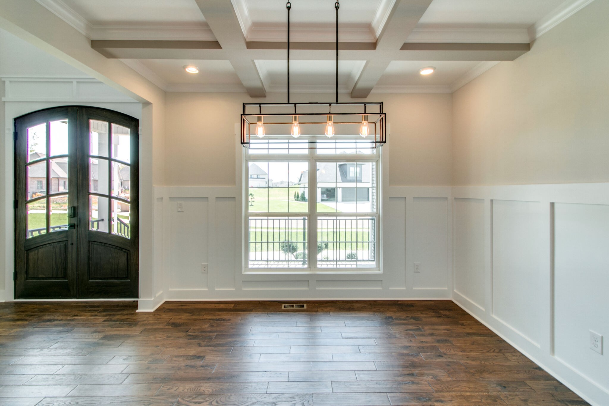 259 Harrowgate Drive Clarksville, TN 37043 - Photo 13 of 39 a view of an empty room with wooden floor and a window