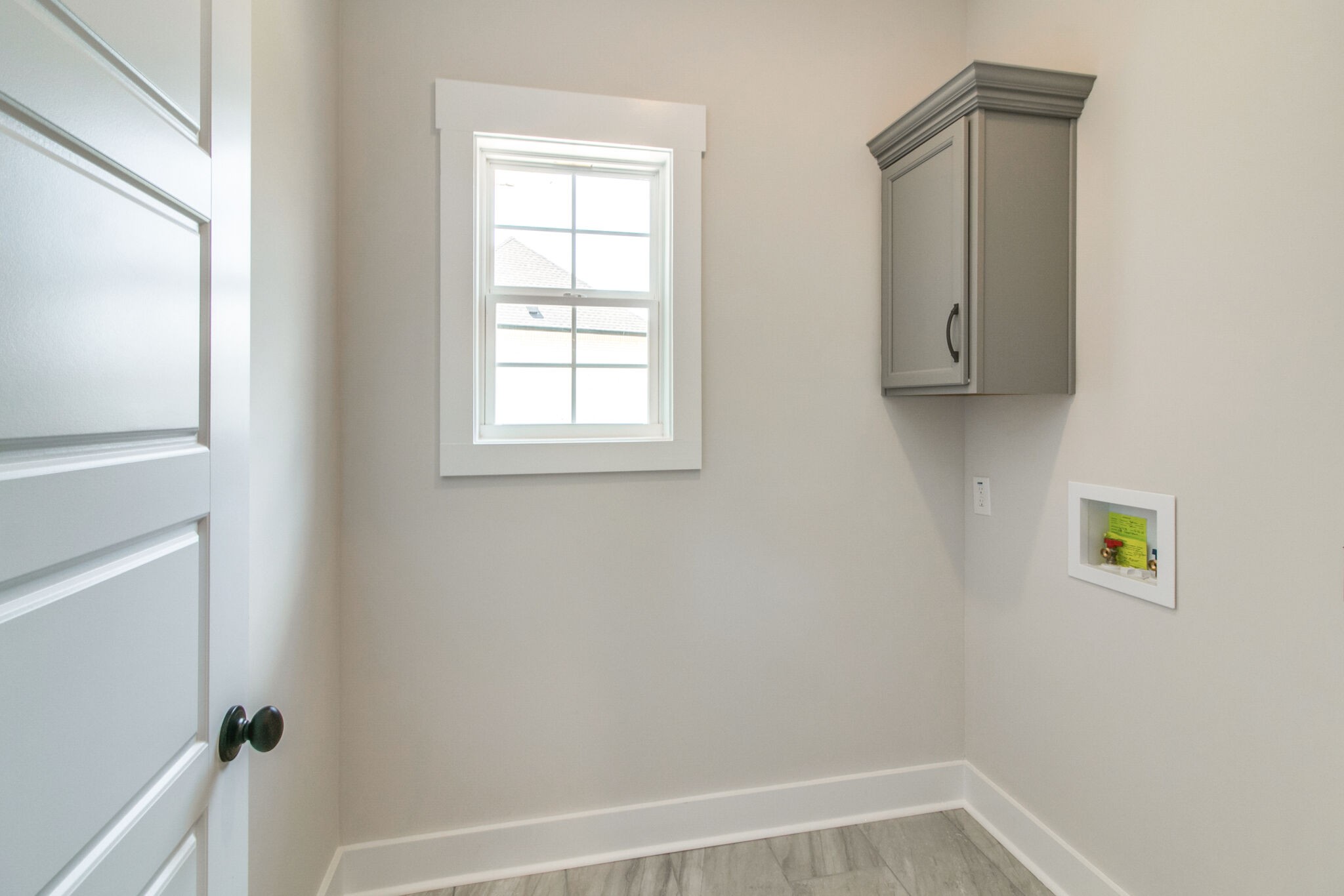 259 Harrowgate Drive Clarksville, TN 37043 - Photo 22 of 39 a view of an empty room with wooden floor and a window