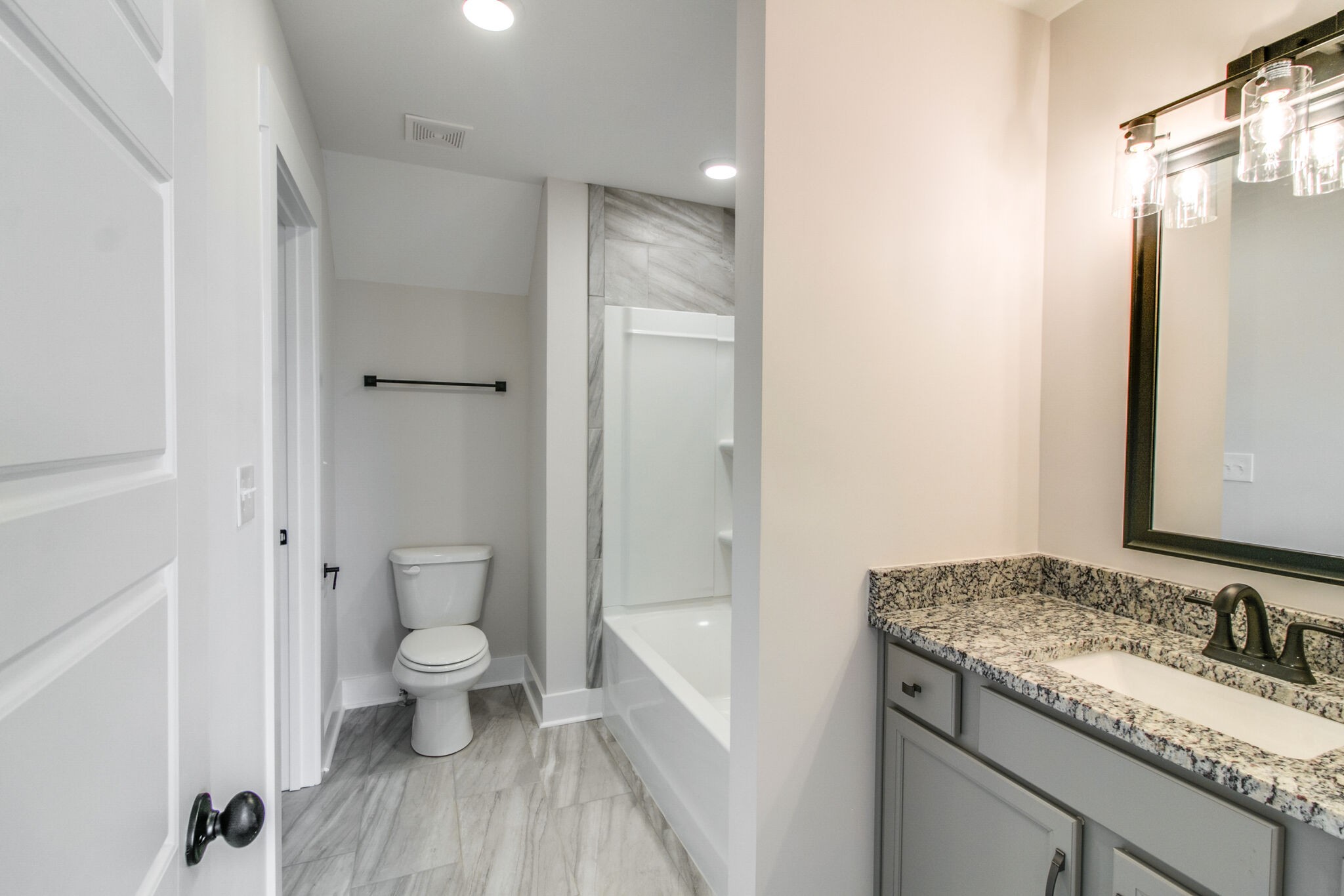 259 Harrowgate Drive Clarksville, TN 37043 - Photo 27 of 39 a bathroom with a granite countertop sink toilet and shower