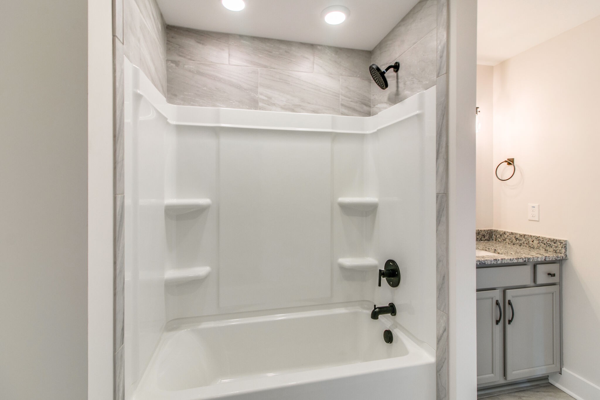 259 Harrowgate Drive Clarksville, TN 37043 - Photo 28 of 39 a bathroom with a bathtub and a shower