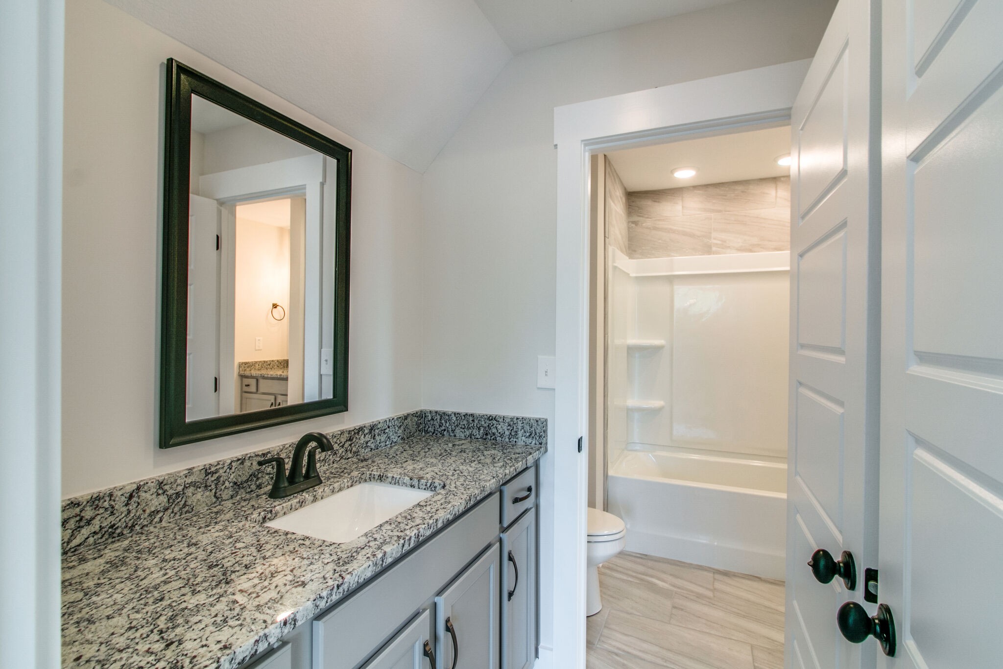 259 Harrowgate Drive Clarksville, TN 37043 - Photo 29 of 39 a bathroom with a granite countertop sink and a mirror