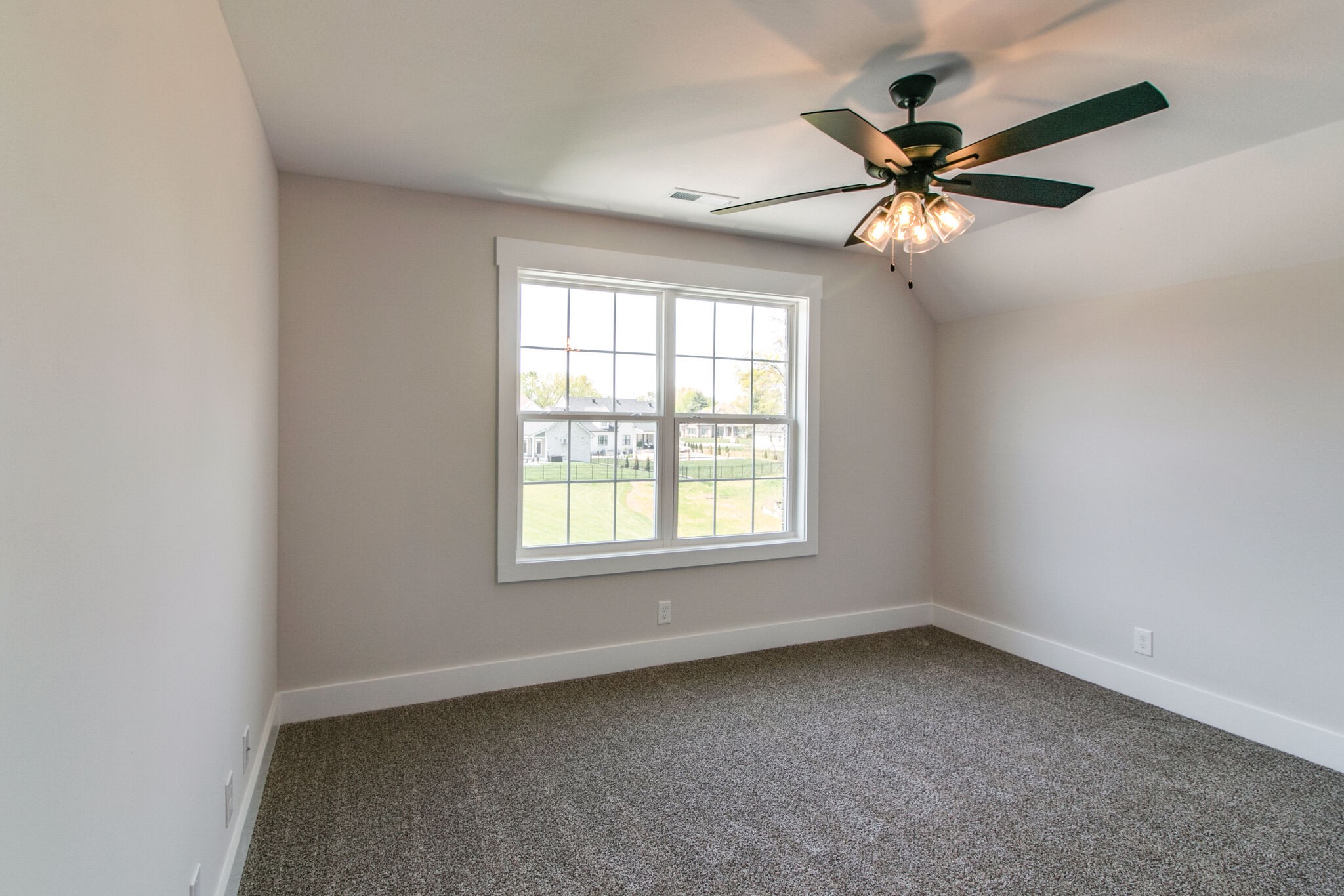 259 Harrowgate Drive Clarksville, TN 37043 - Photo 30 of 39 an empty room with a window and a fan