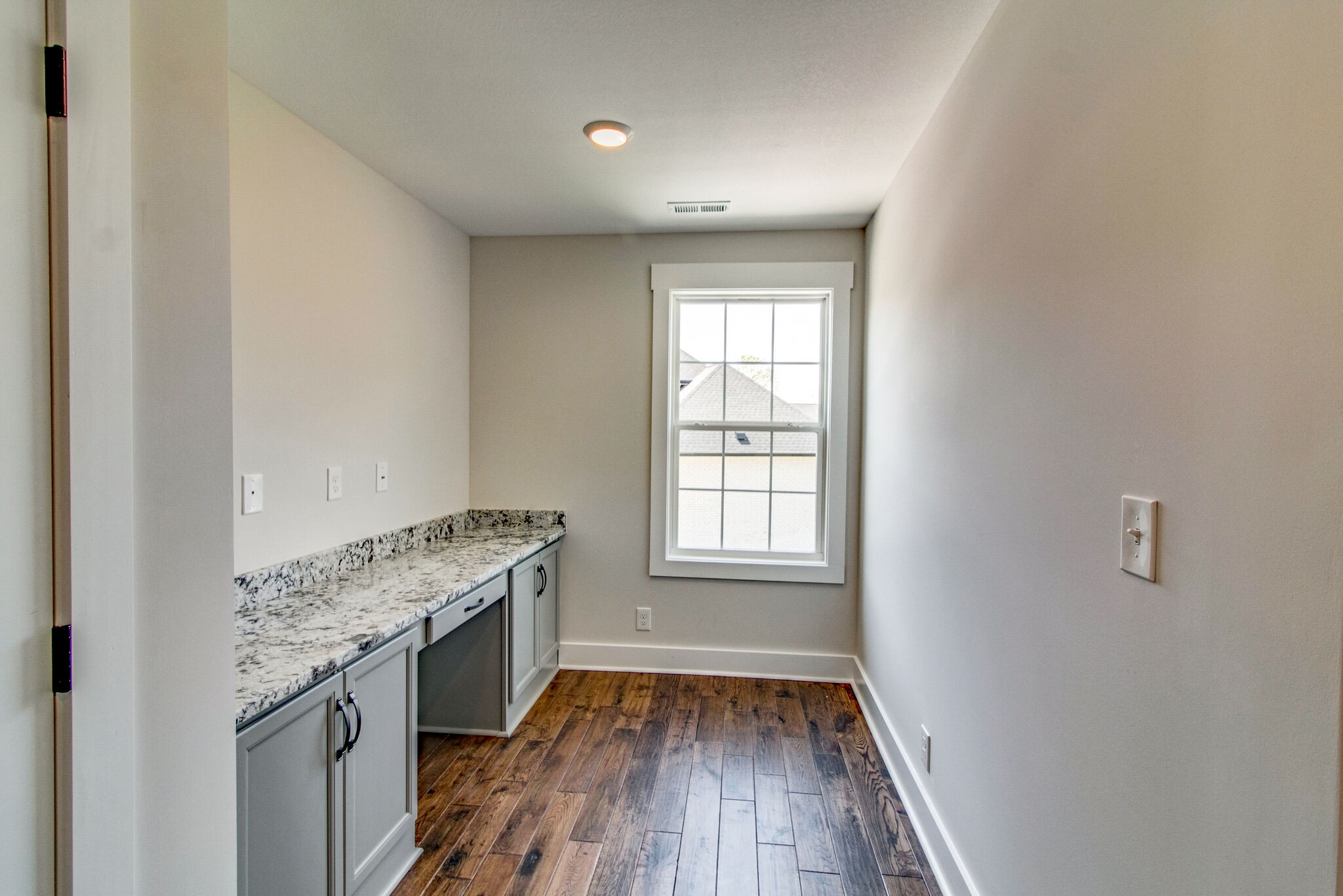 259 Harrowgate Drive Clarksville, TN 37043 - Photo 31 of 39 a view of an empty room with wooden floor and a window