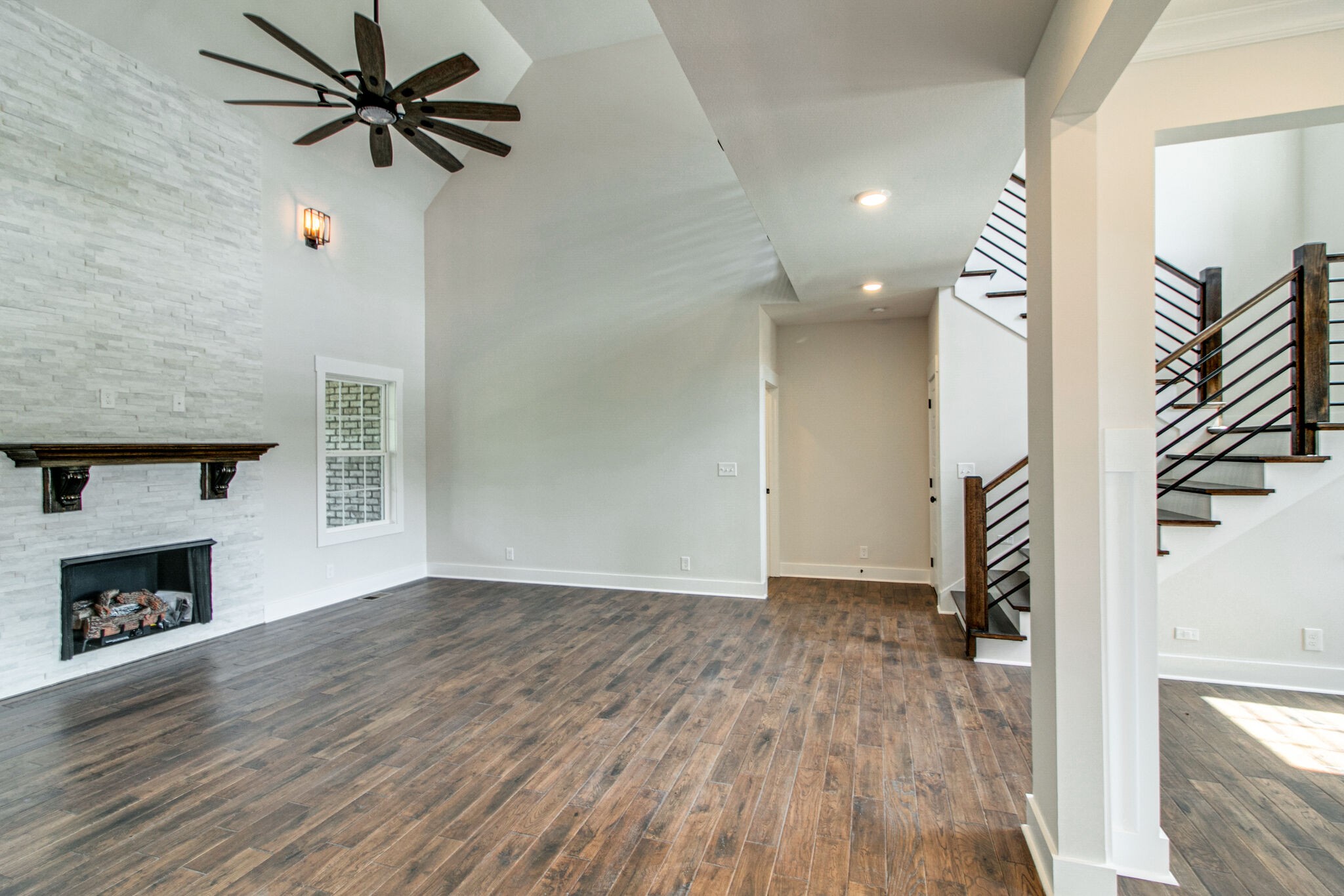 259 Harrowgate Drive Clarksville, TN 37043 - Photo 8 of 39 a view of empty room with wooden floor and fan