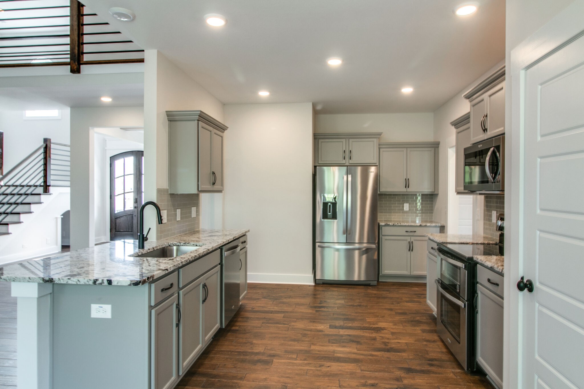 259 Harrowgate Drive Clarksville, TN 37043 - Photo 10 of 39 a kitchen with stainless steel appliances granite countertop a refrigerator and a stove