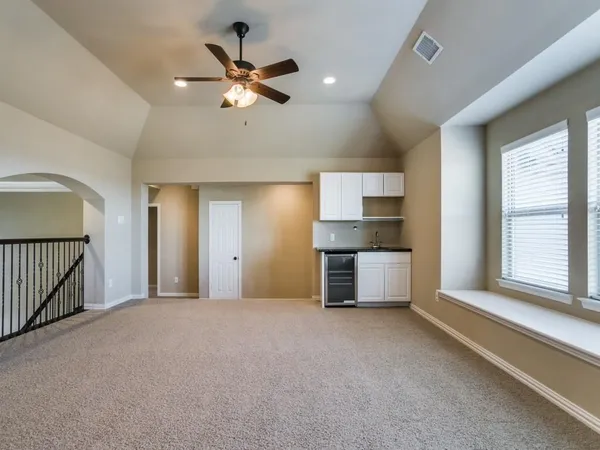 a view of an empty room with a window