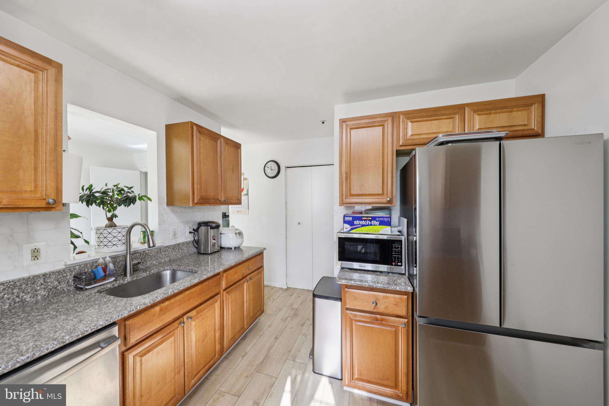 12014 Swallow Falls Court Silver Spring, MD 20904 - Photo 14 of 48 a kitchen with stainless steel appliances a refrigerator and a sink