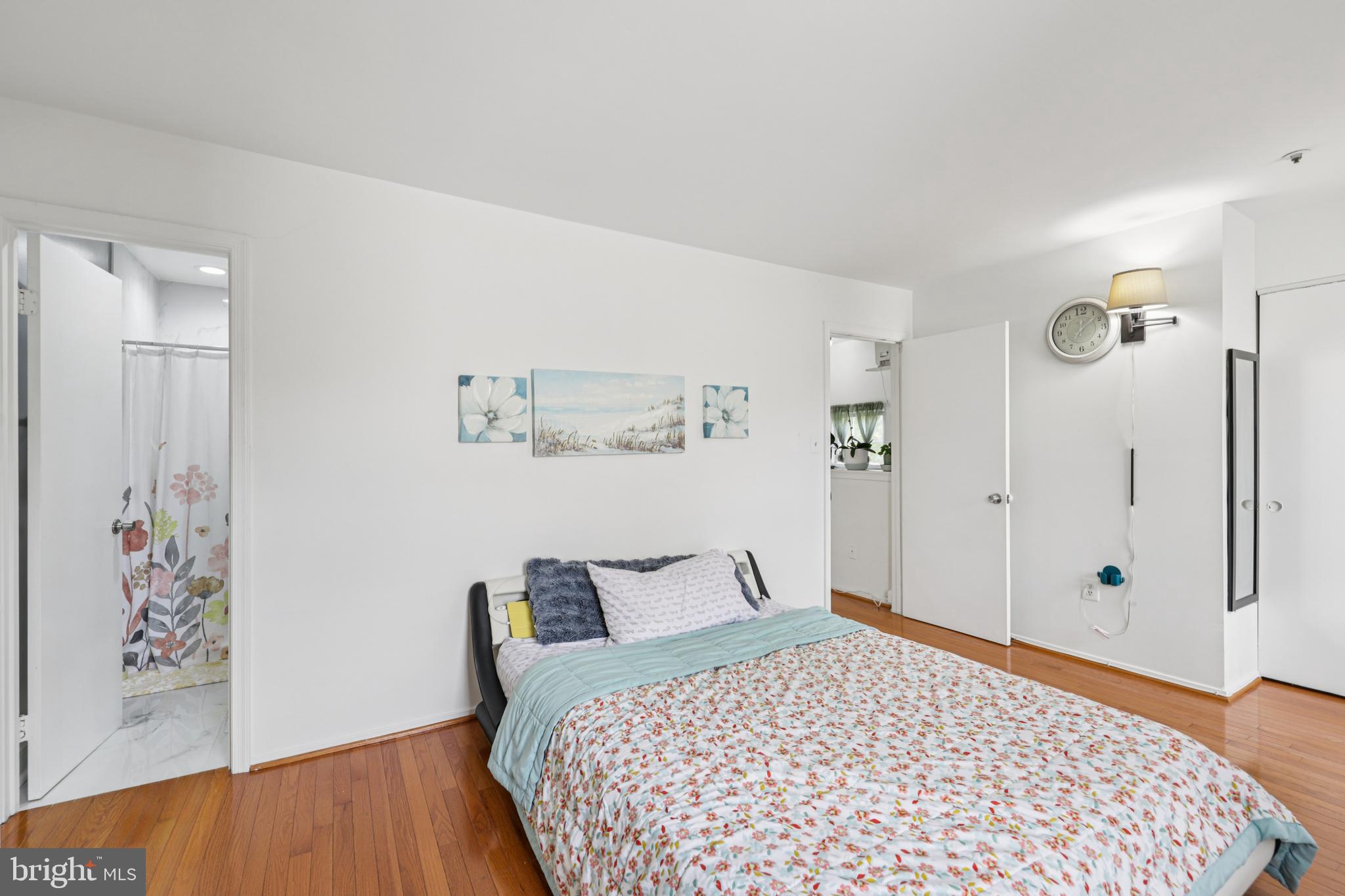 12014 Swallow Falls Court Silver Spring, MD 20904 - Photo 19 of 48 a bedroom with a bed and a painting on the wall