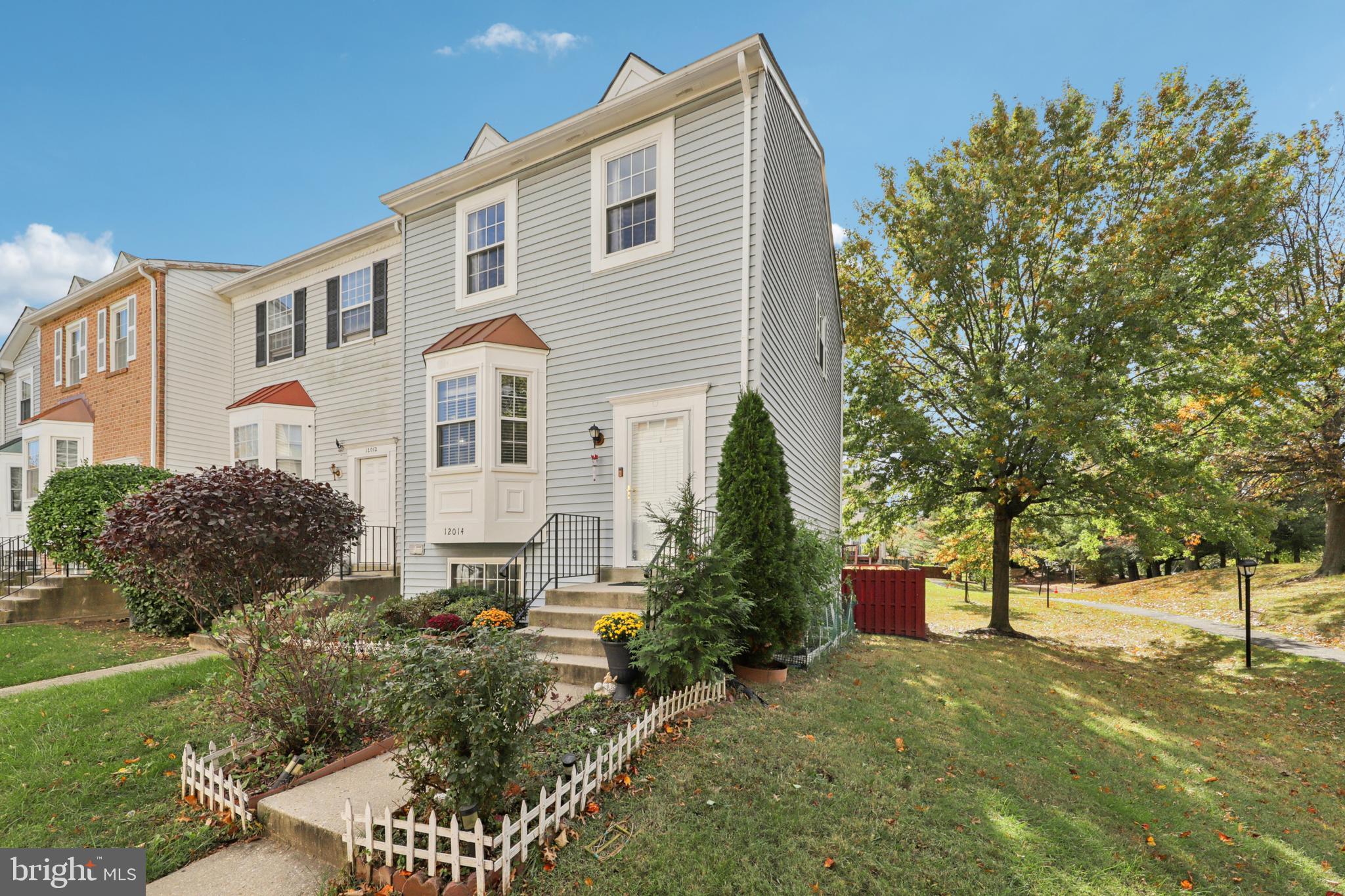 12014 Swallow Falls Court Silver Spring, MD 20904 - Photo 2 of 48 a front view of a house with a yard and trees