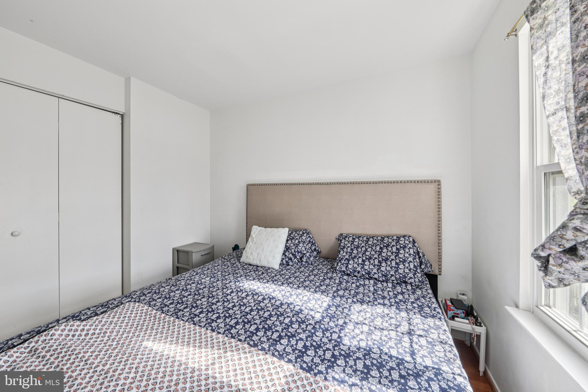 12014 Swallow Falls Court Silver Spring, MD 20904 - Photo 24 of 48 a bedroom with a large bed and a window