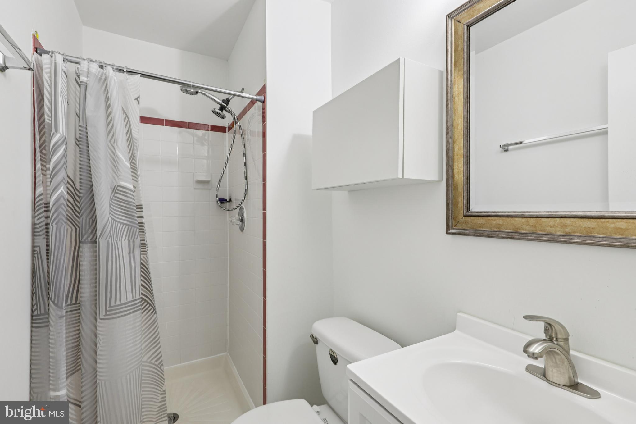 12014 Swallow Falls Court Silver Spring, MD 20904 - Photo 35 of 48 a bathroom with a sink toilet and shower