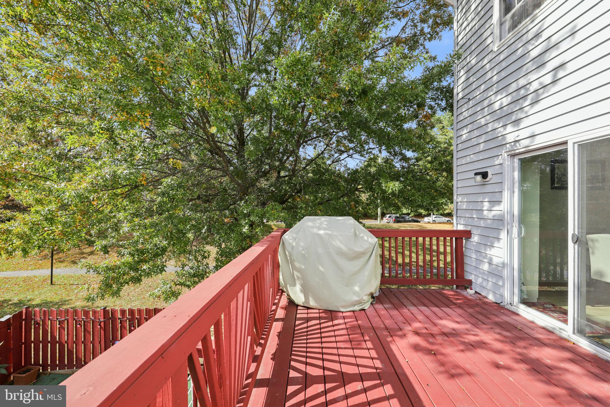 12014 Swallow Falls Court Silver Spring, MD 20904 - Photo 39 of 48 a view of balcony with wooden floor and outdoor seating
