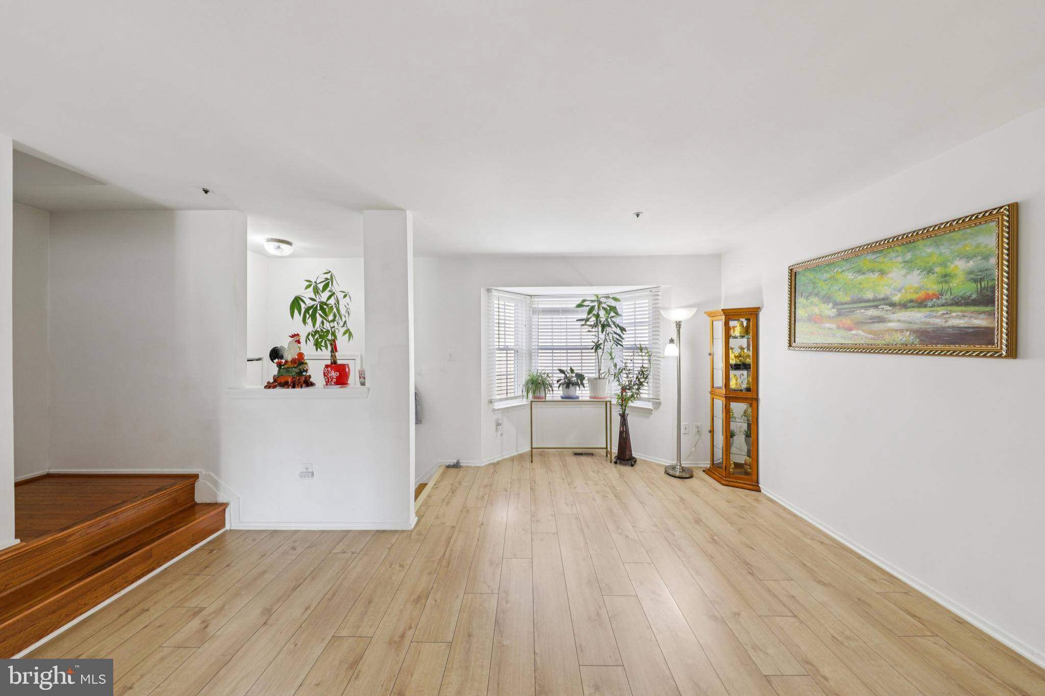 12014 Swallow Falls Court Silver Spring, MD 20904 - Photo 5 of 48 a room with wooden floor and a workspace
