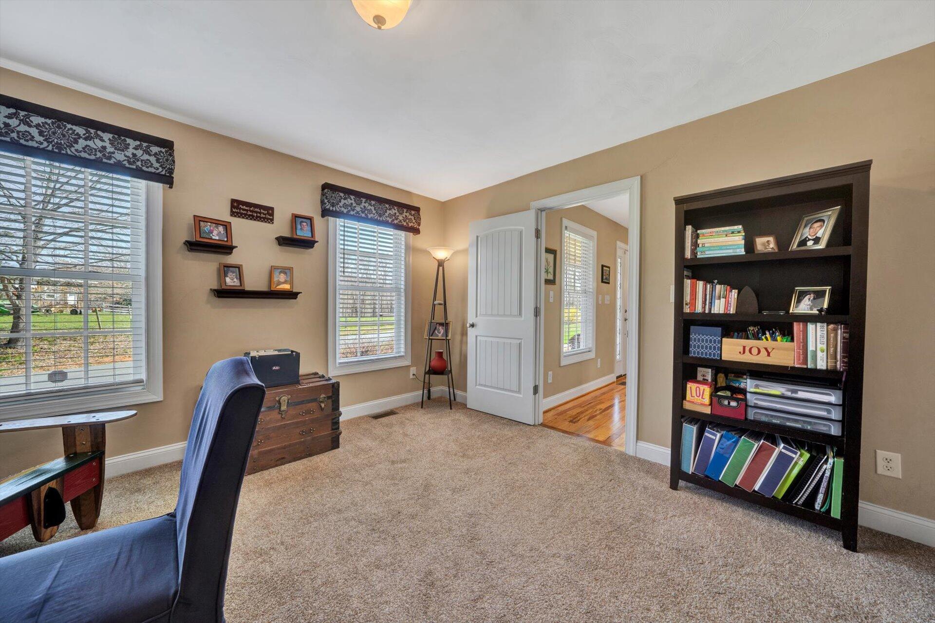 60 Green Level Road Boones Mill, VA 24065 - Photo 13 of 53 a living room with furniture and a book shelf
