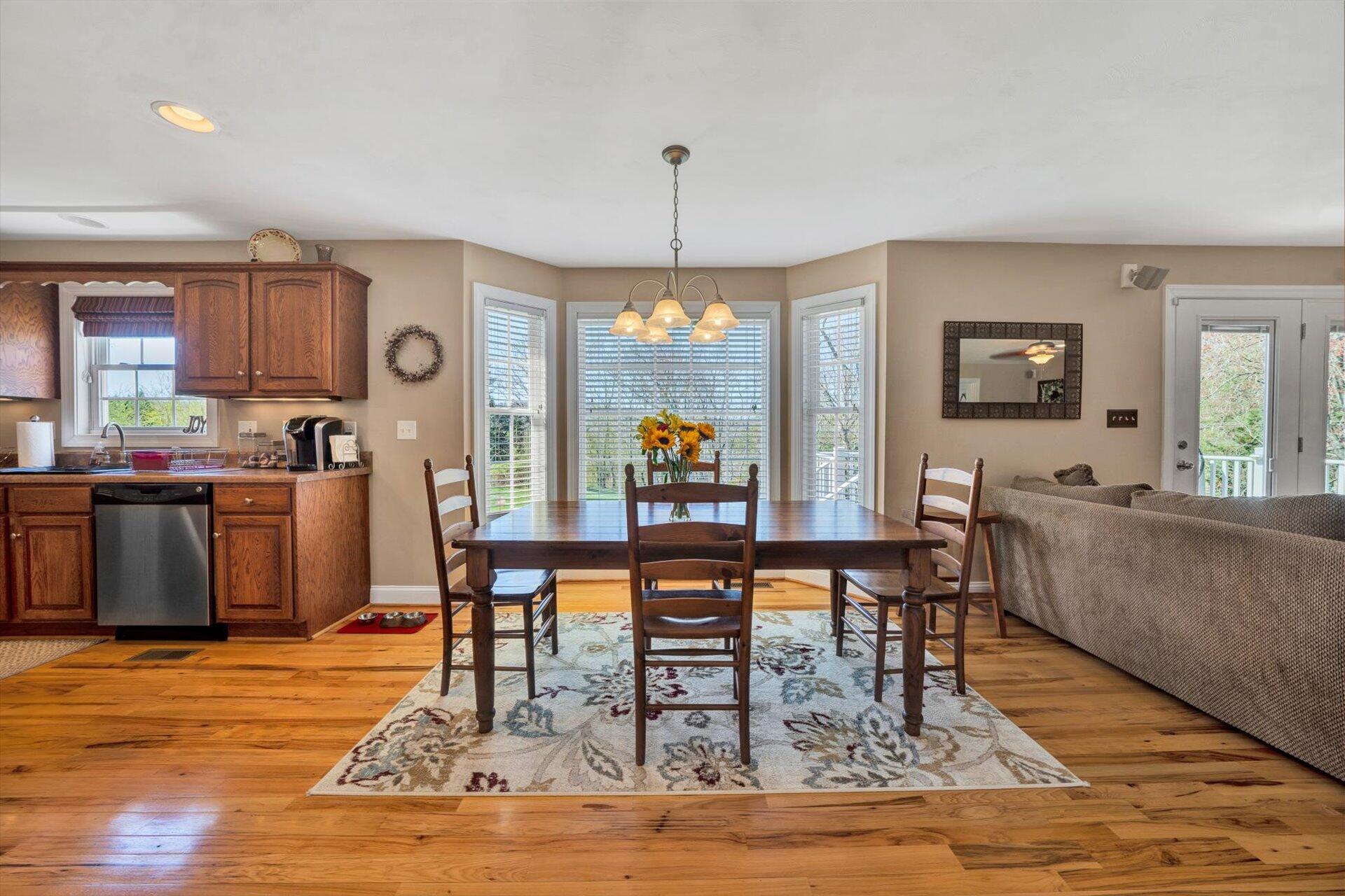 60 Green Level Road Boones Mill, VA 24065 - Photo 19 of 53 a living room with furniture and a chandelier