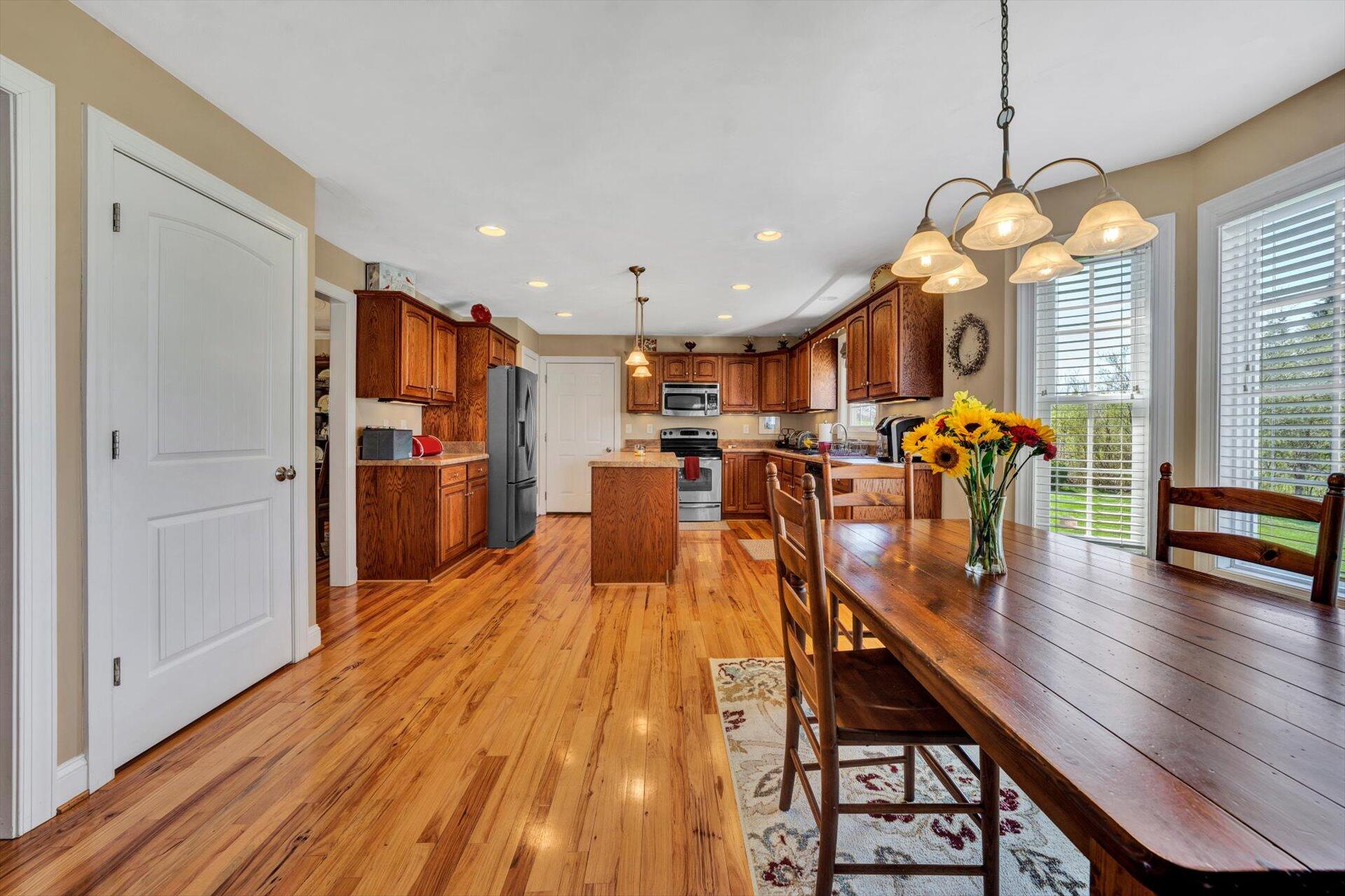 60 Green Level Road Boones Mill, VA 24065 - Photo 20 of 53 a dining room with furniture and wooden floor