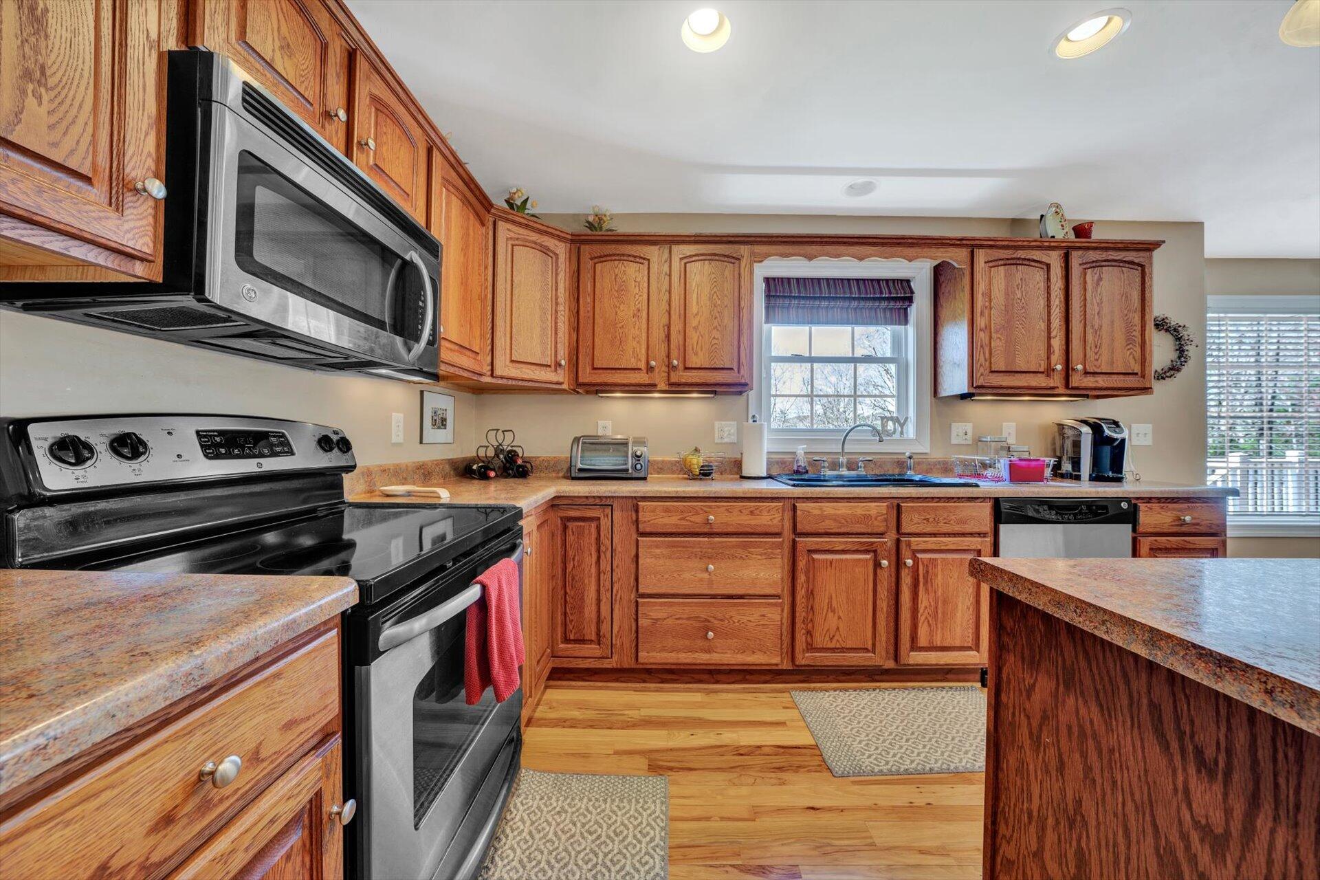 60 Green Level Road Boones Mill, VA 24065 - Photo 24 of 53 a kitchen with stainless steel appliances granite countertop a stove sink and cabinets
