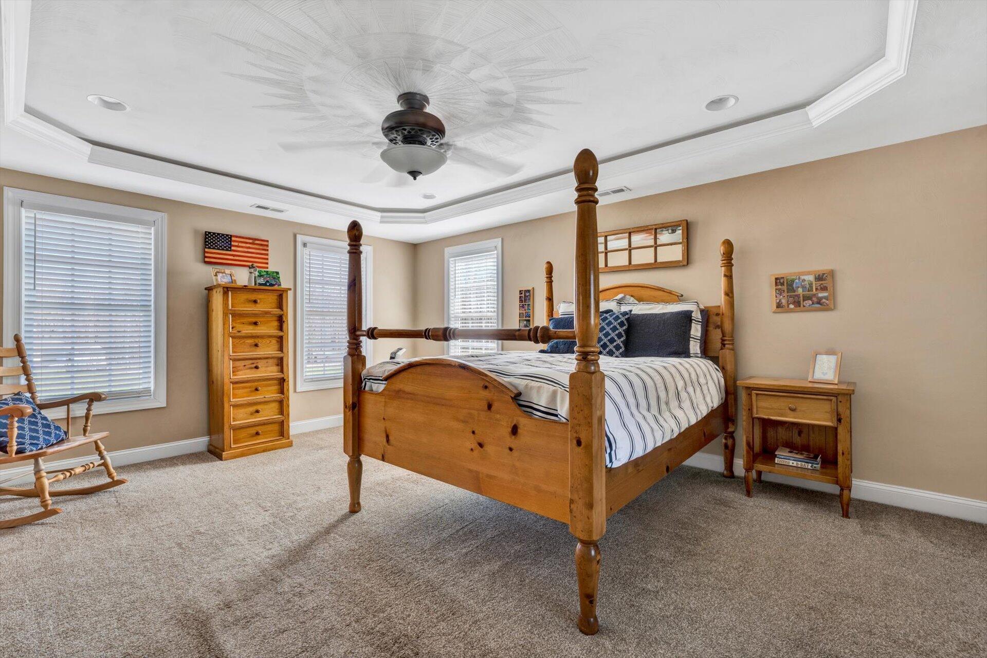 60 Green Level Road Boones Mill, VA 24065 - Photo 30 of 53 a bedroom with a bed and a chandelier