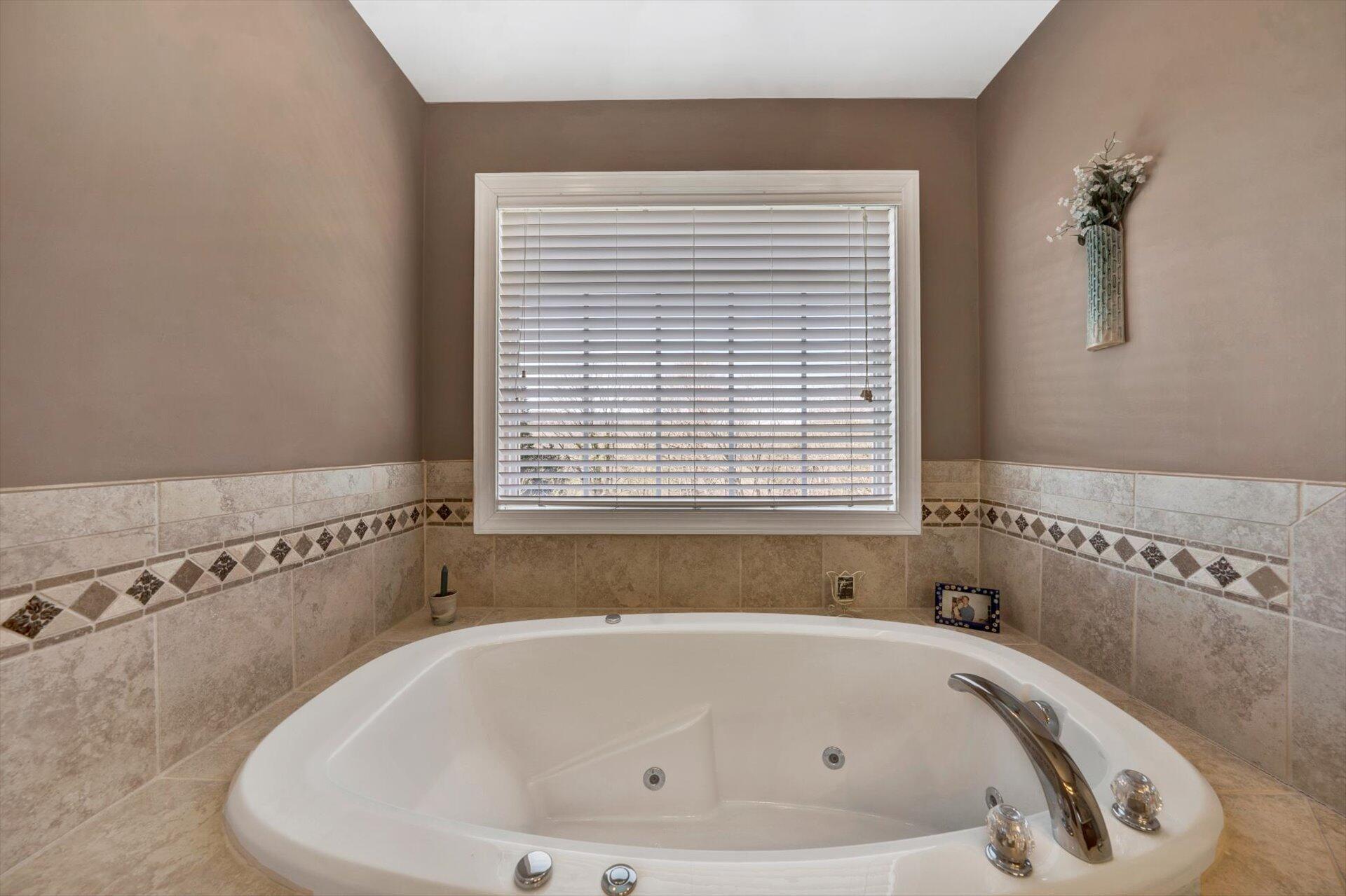 60 Green Level Road Boones Mill, VA 24065 - Photo 34 of 53 a white bath tub sitting in a bathroom next to a window
