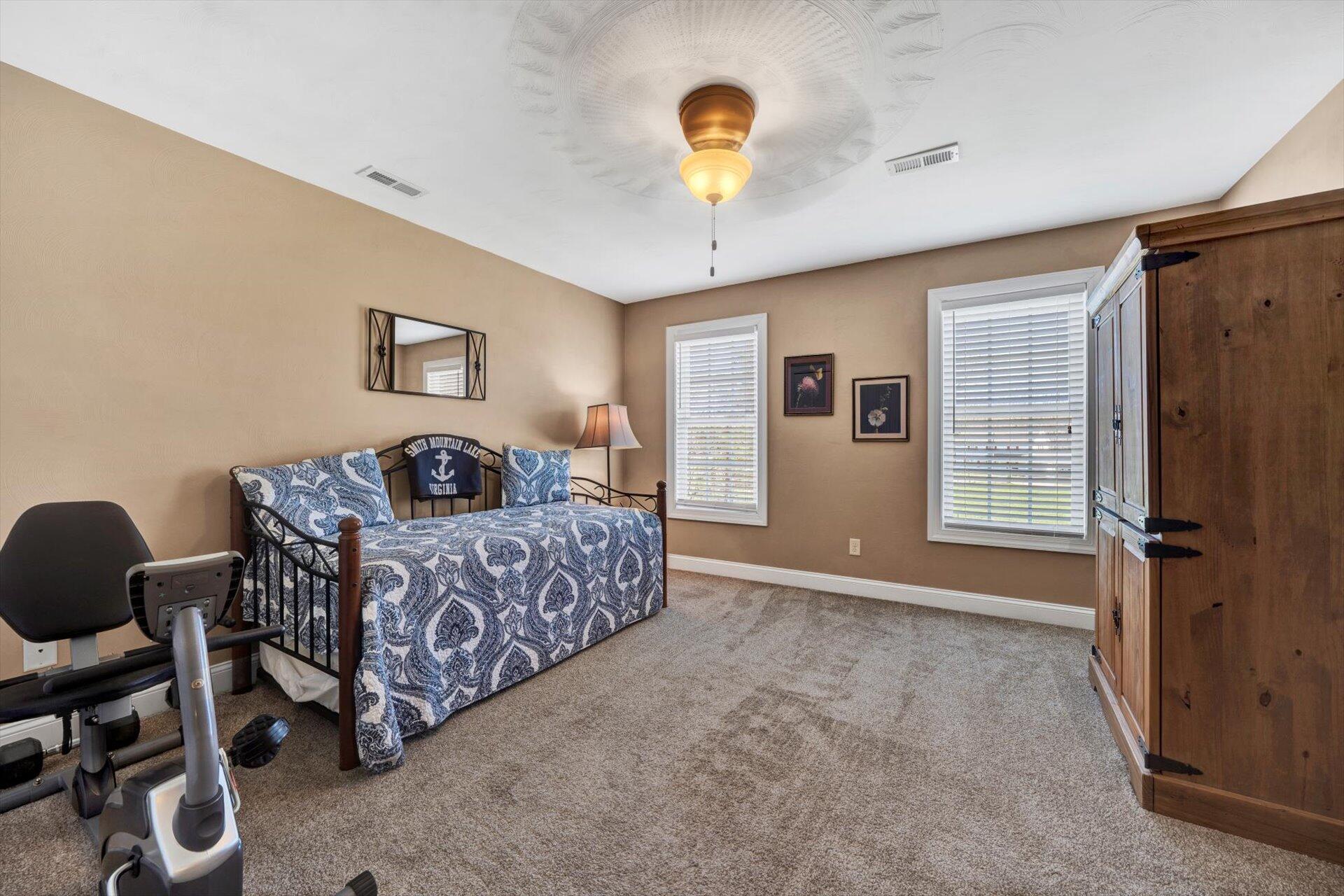60 Green Level Road Boones Mill, VA 24065 - Photo 40 of 53 a bedroom with furniture and a window