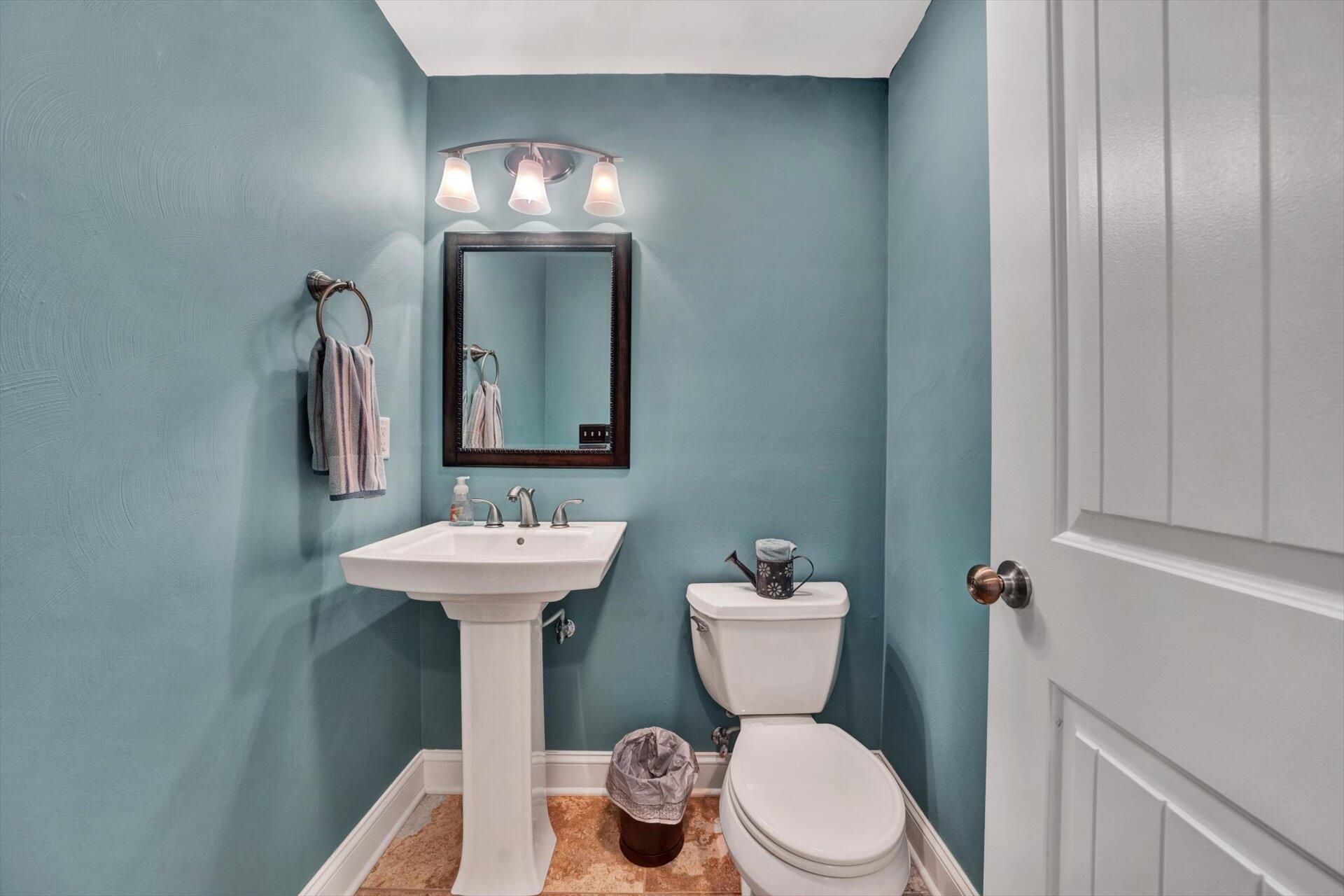 60 Green Level Road Boones Mill, VA 24065 - Photo 43 of 53 a bathroom with a toilet sink and mirror