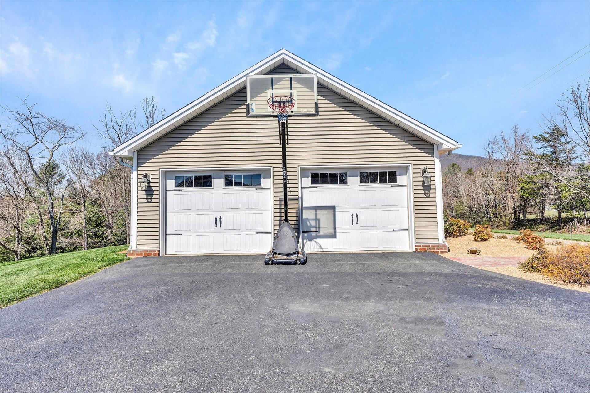60 Green Level Road Boones Mill, VA 24065 - Photo 46 of 53 a view of a house with a yard and garage