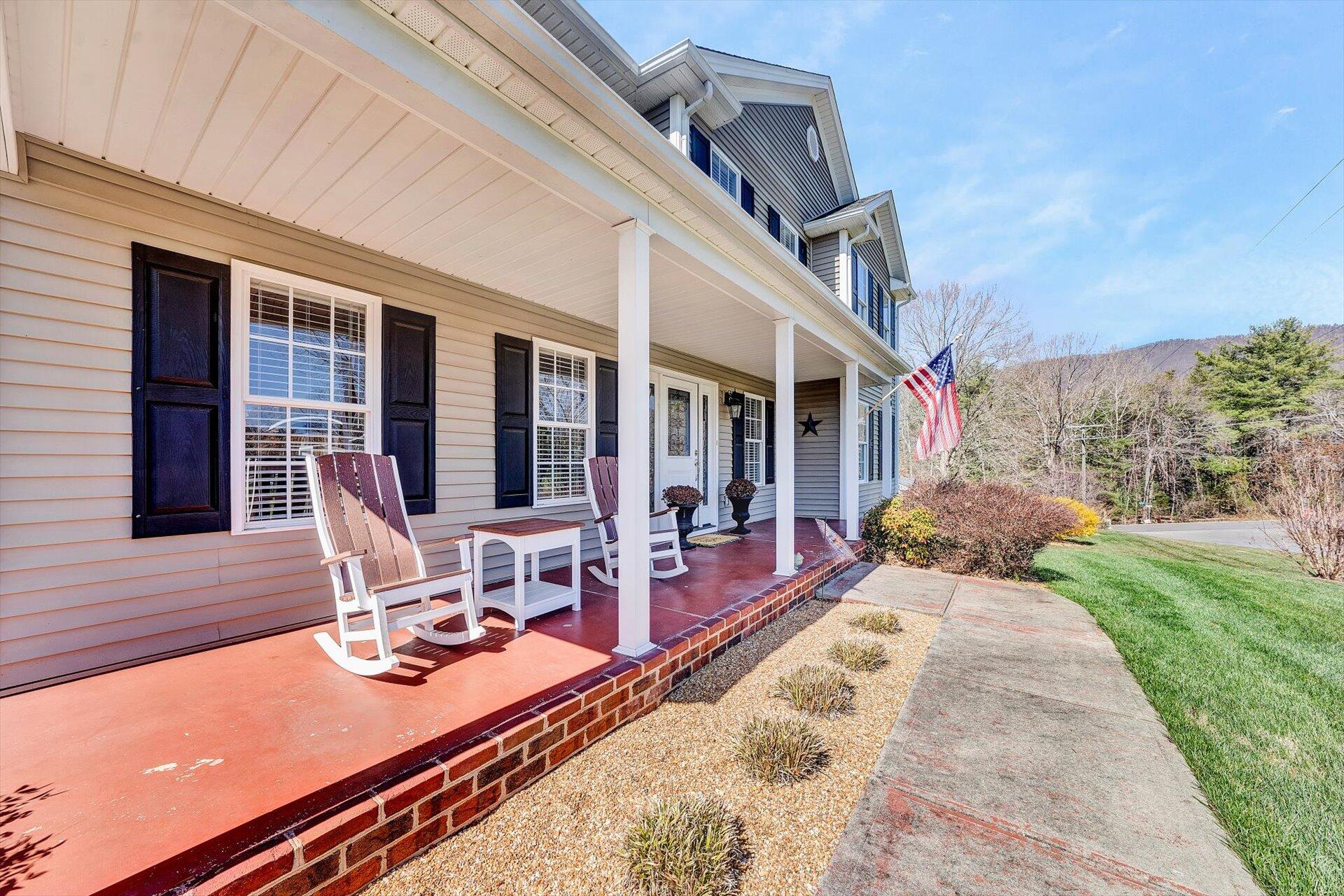60 Green Level Road Boones Mill, VA 24065 - Photo 6 of 53 a view of a house with backyard sitting area and porch