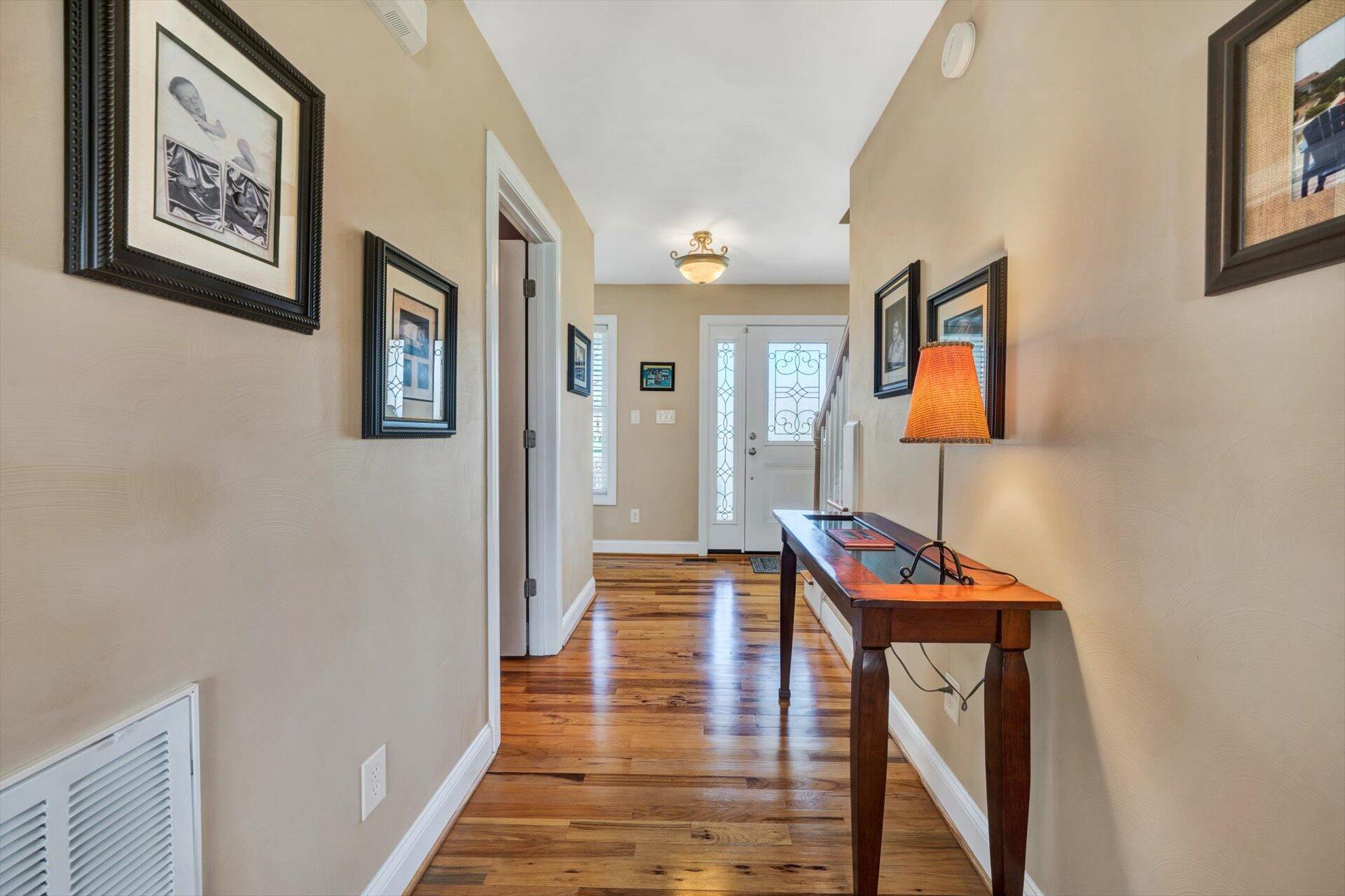 60 Green Level Road Boones Mill, VA 24065 - Photo 7 of 53 a hallway with furniture and wooden floor