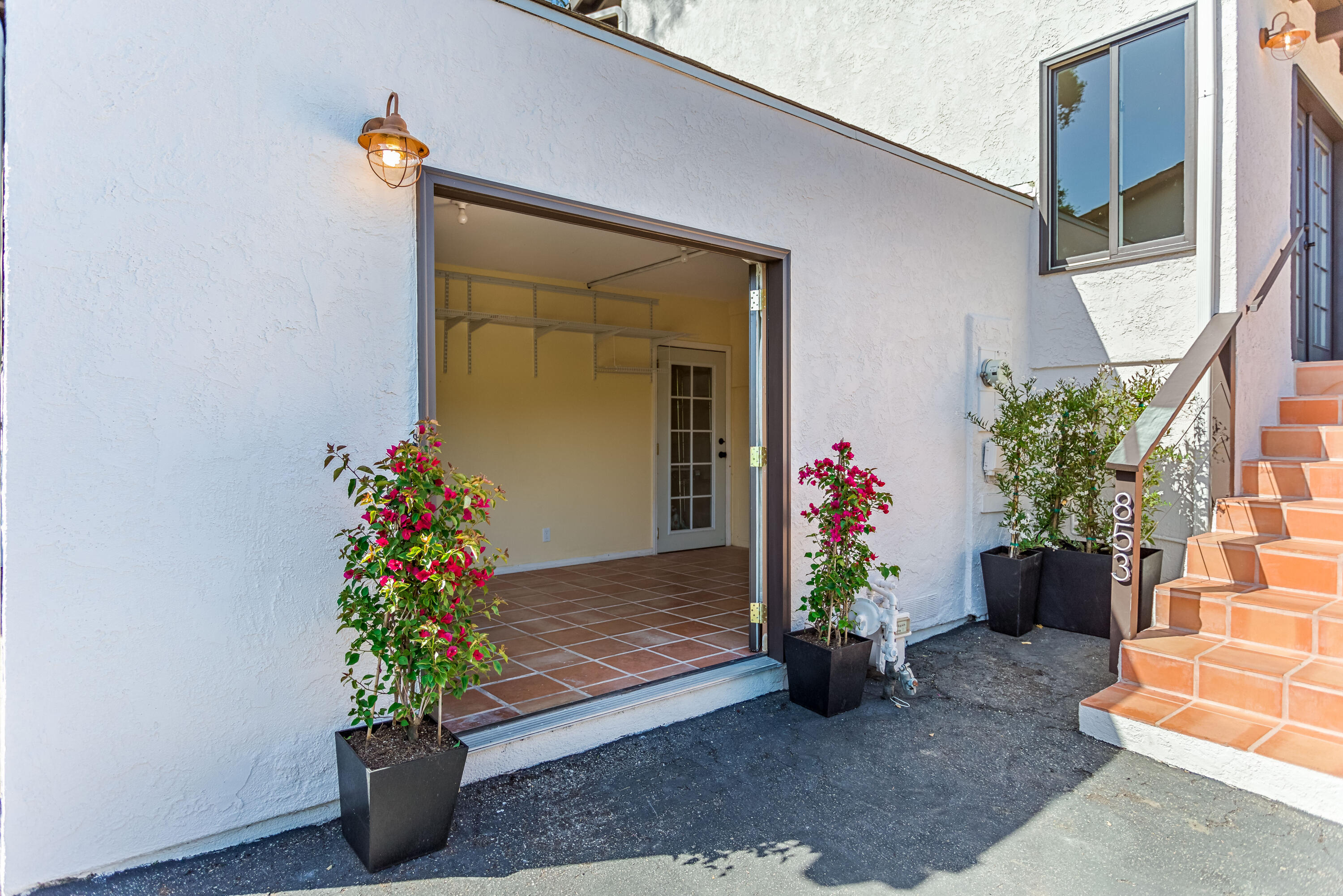 853 Fellowship Road Santa Barbara, CA 93109 - Photo 24 of 34 a potted plant sitting in front of a house