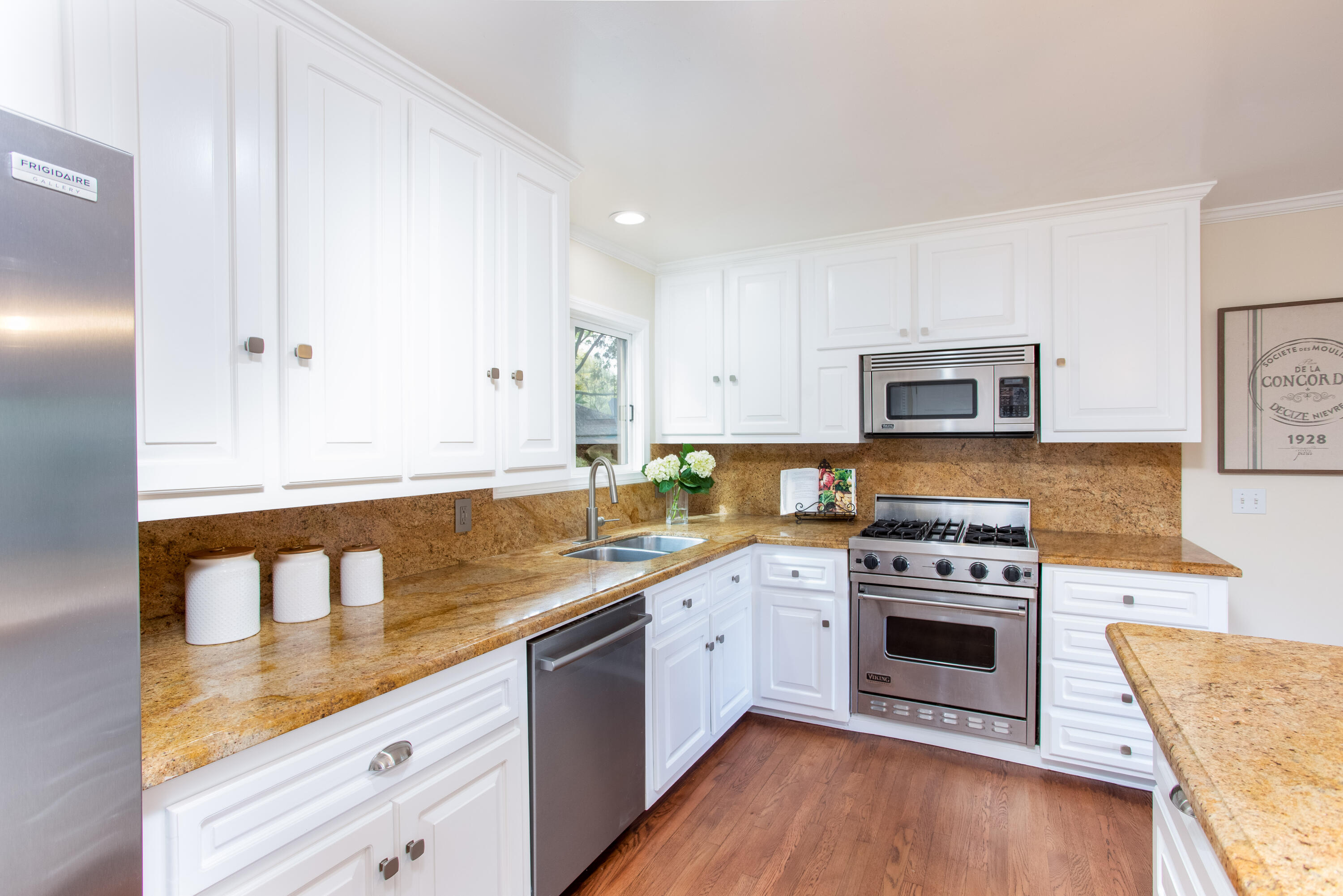 853 Fellowship Road Santa Barbara, CA 93109 - Photo 9 of 34 a kitchen with stainless steel appliances granite countertop a stove a sink and a microwave