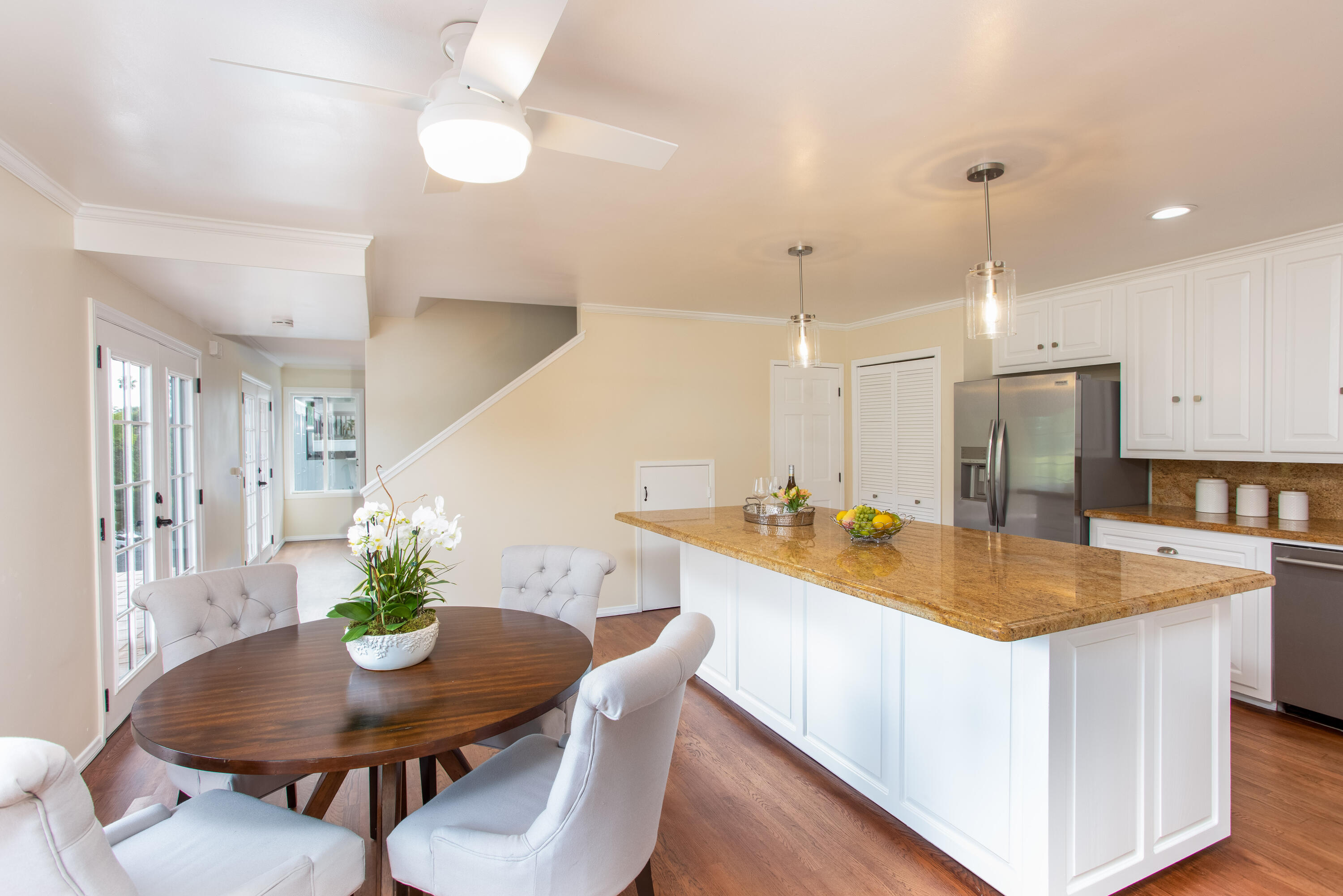 853 Fellowship Road Santa Barbara, CA 93109 - Photo 10 of 34 a room with stainless steel appliances kitchen island a table and chairs in it