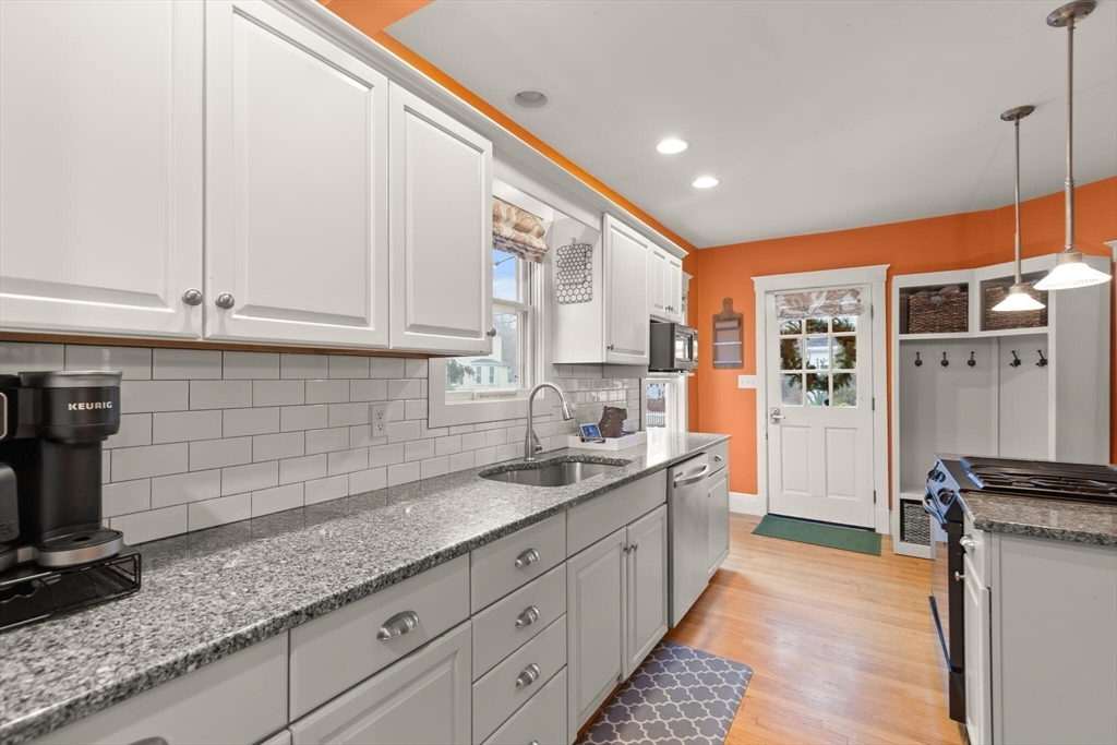 142 Railroad Avenue Hamilton, MA 01982 - Photo 12 of 29 a kitchen with granite countertop a sink and cabinets