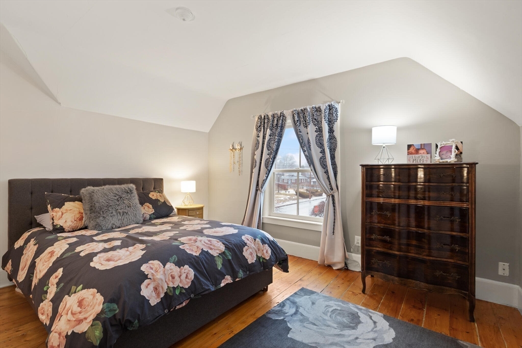 142 Railroad Avenue Hamilton, MA 01982 - Photo 16 of 29 a bedroom with a bed closet and a window