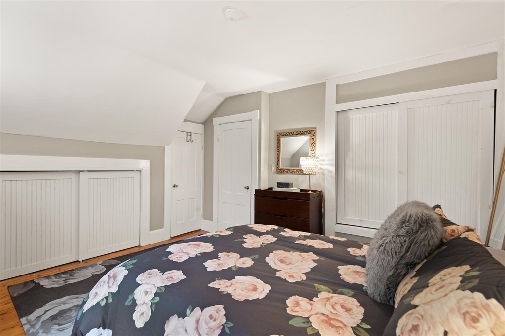 142 Railroad Avenue Hamilton, MA 01982 - Photo 17 of 29 a bedroom with a bed and a window