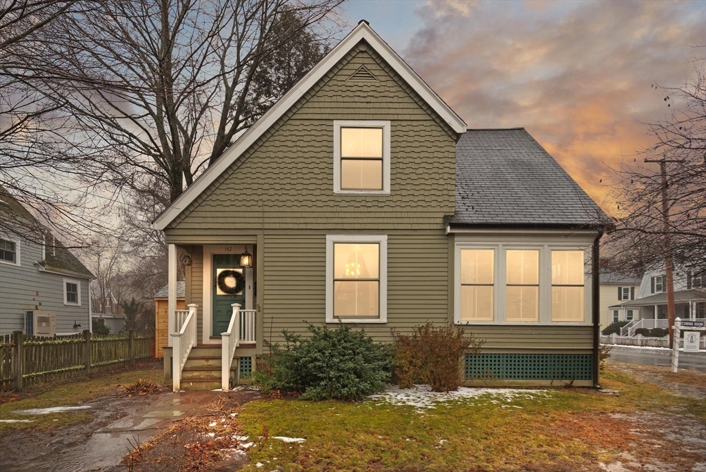 142 Railroad Avenue Hamilton, MA 01982 - Photo 26 of 29 a front view of a house with a yard