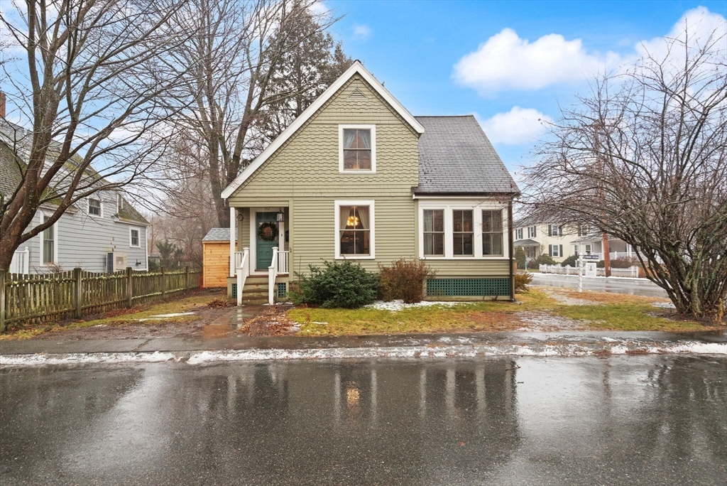 142 Railroad Avenue Hamilton, MA 01982 - Photo 27 of 29 a view of a yard in front of a house with a large tree