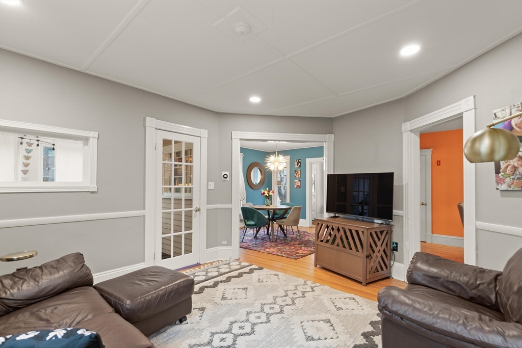 142 Railroad Avenue Hamilton, MA 01982 - Photo 6 of 29 a living room with furniture and a flat screen tv