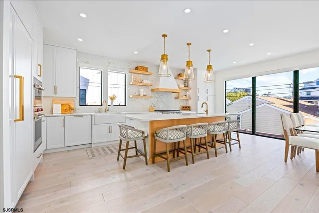 a bedroom with a bed and a flat tv screen on dresser