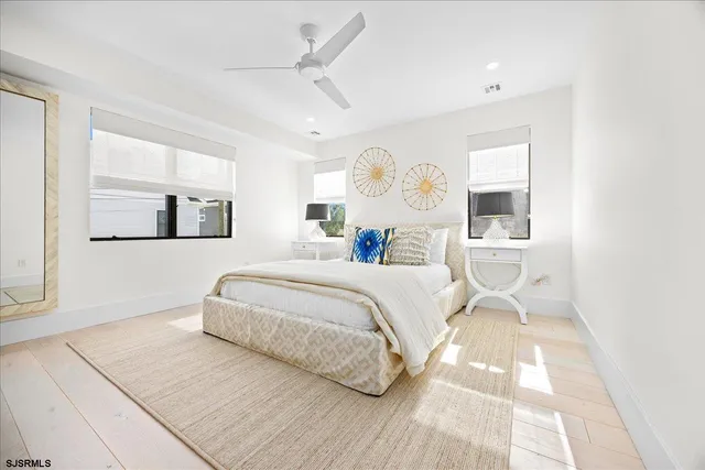 a bathroom with a shower sink and mirror