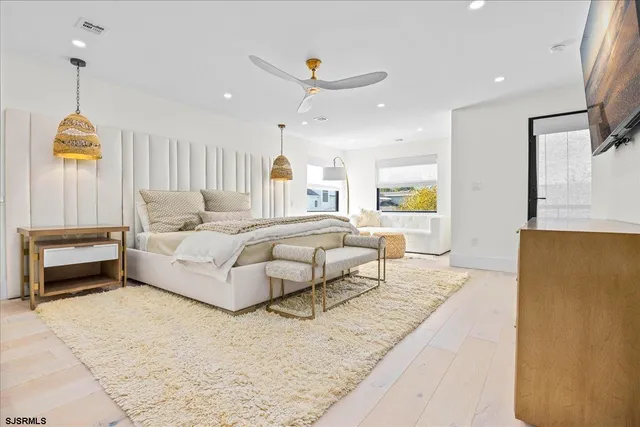 a view of a hallway with paintings on the wall