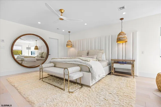 a bedroom with a bed and a night stand