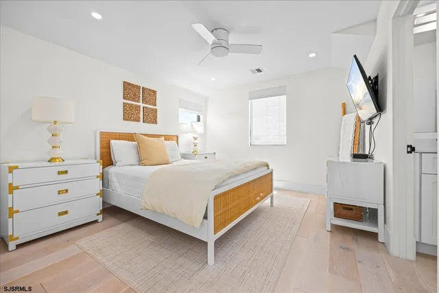 a view of a bathroom with a sink and mirror