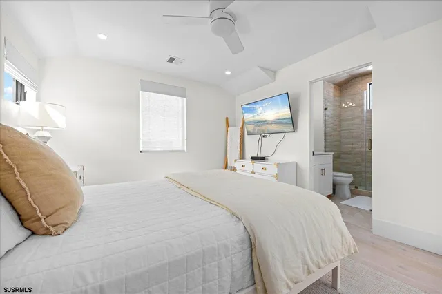 a dining room with furniture a flat screen tv and outdoor view