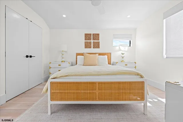 a living room with a fireplace furniture a rug and white walls