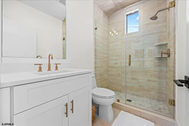 a view of a patio with couple of chairs and couch