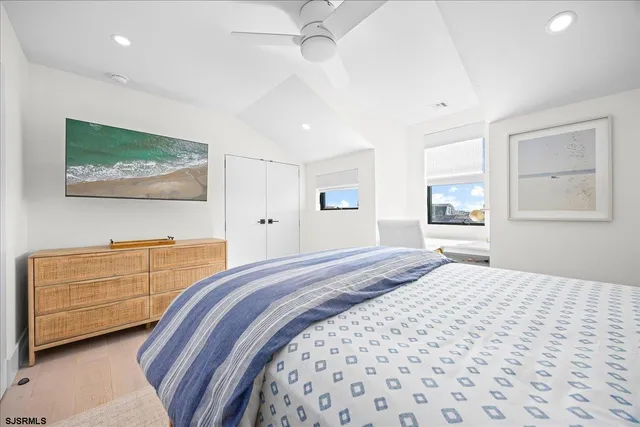 a front view of a residential apartment building with a yard