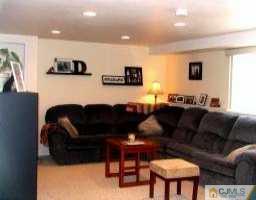 30 Albemarle Road Colonia, NJ 07067 - Photo 3 of 7 a projector room with furniture a flat screen tv and a window