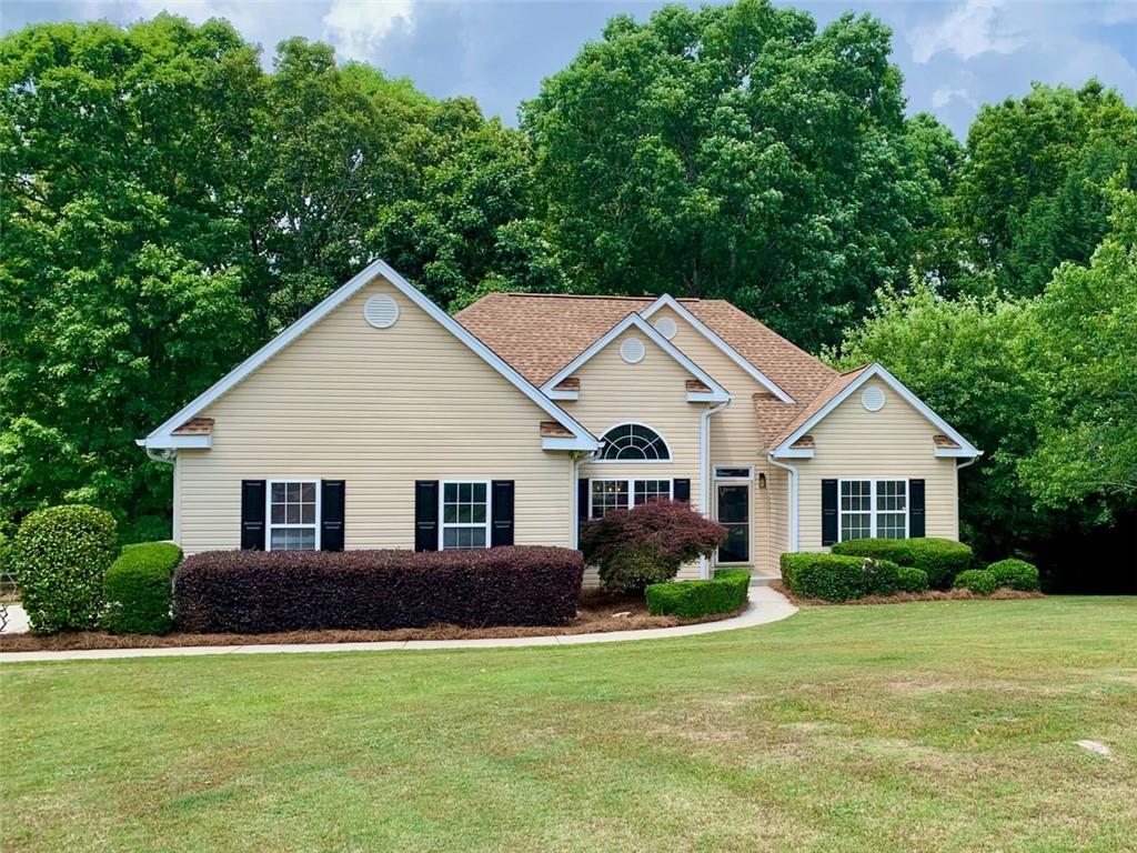 3834 Covered Bridge Place Gainesville, GA 30506 - Photo 1 of 1 a front view of a house with a yard
