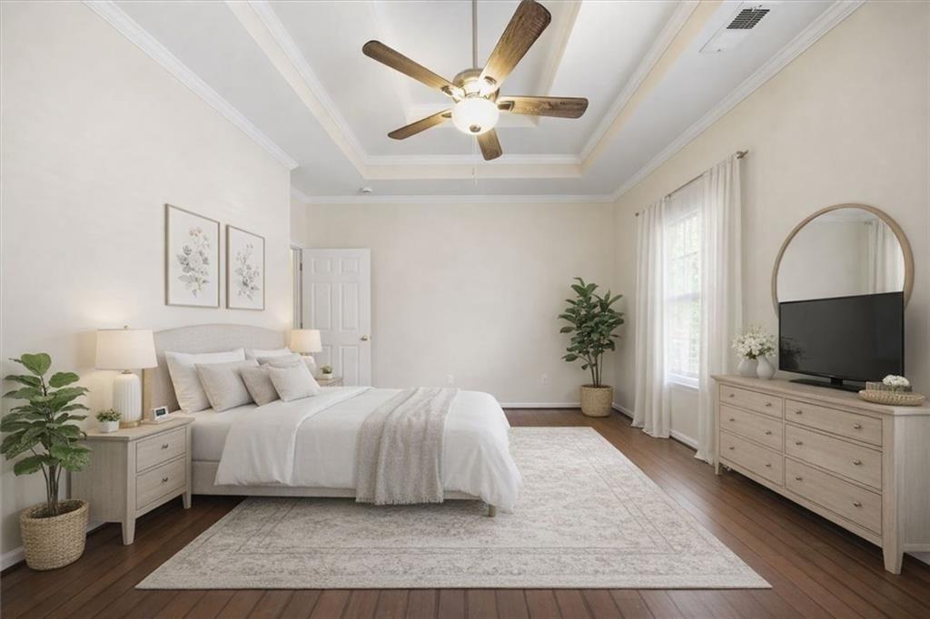 111 Stonegate Lane Canton, GA 30114 - Photo 15 of 30 a spacious bedroom with a bed and a flat screen tv