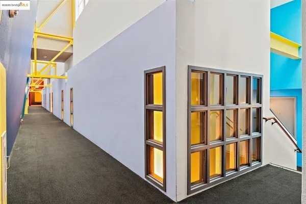 an aerial view of house with yard swimming pool and ocean view